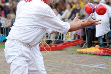 Man collecting two cheeses, in the weekly cheese market, Edam, The Netherlands