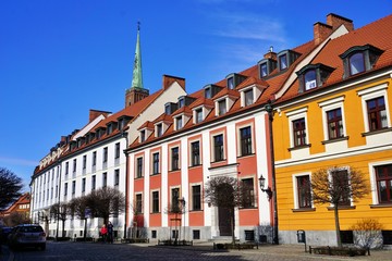 Naklejka premium Ostrow Tumski in Wroclaw - the oldest part of the city with colourful, old tenement houses, lanterns, bridges and churches. Lovely place for walk.