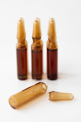 Six brown ampoules with medicine