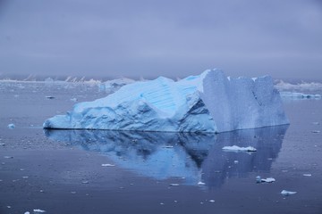 Fototapeta na wymiar Stunning Iceberg Reflection , Paradise Bay , Antarctica 