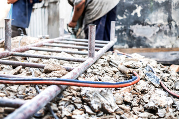 Oxy Acetylene Oxy-fuel welding and cutting head tool on the ground at construction site.