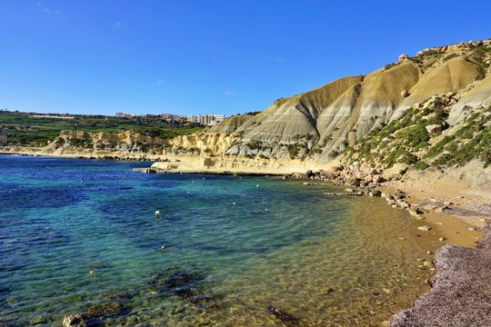 Xatt L-Ahmar - stony seaside with characteristic  sandstone cliffs and crystal blue water. Ideal place for picnic or sunbathing, diving, snorkelling and swimming far away from crowdy beaches.