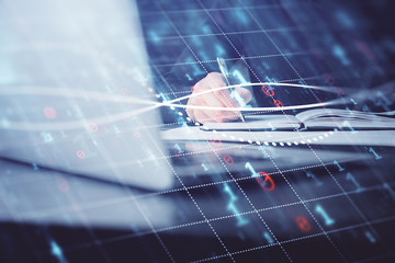Double exposure of businessman with laptop and stock market forex chart.