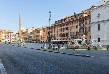 Fototapeta na wymiar Following the coronavirus outbreak, the italian Government has decided for a massive curfew, leaving even the Old Town, usually crowded, completely deserted. Here in particular Piazza Navona