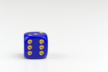 Six points on single blue dice isolated on white background