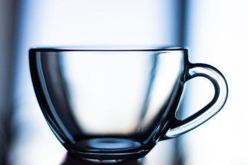 Side view of an empty transparent glass сup.