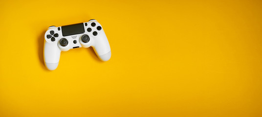 Videgame competition. Gaming concept. White joystick on yellow background. - obrazy, fototapety, plakaty