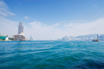 Naklejka premium Central business district Hong Kong with a clear blue sky above the harbour. The 12th of December 2017.