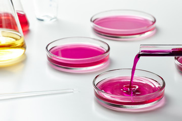 Closeup of a glass tube with a drop of liquid