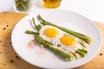 Stir-fried eggs with green asparagus. Fast lunch ideas, healthy breakfast, summer food.