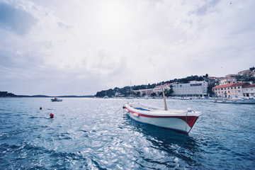 Fishing boats in harbor. Hvar Old Town Promenade. Sea coast in Dalmatia, Croatia.