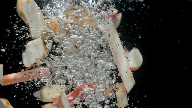 Galangal Drop in Water Slow Motion