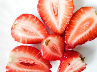 garden berries on a white background. perfect background for slides. an advertising option for farmers. the farm's products. red strawberries. strawberries in sugar