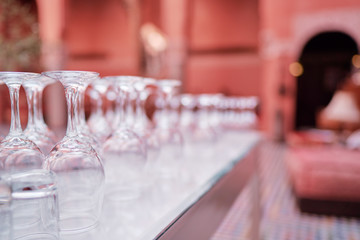 Wineglasses set on white table.