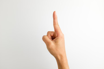 Index finger hand signal on white background