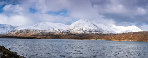 Cold lake and snowy mountains