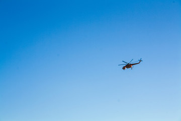 Helicopter flying above the Athens on a bright summer day