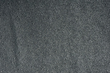 Bitumen roof texture. Black asphalt surface. Grey road granular material