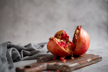 pomegranate seeds on a wooden Board