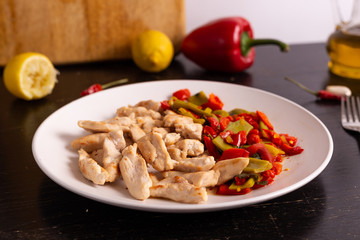 Chicken nuggets with lemon and mix vegetables. Low fat protein lunch, fast lunch.
