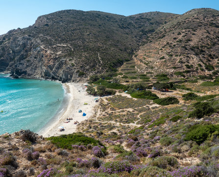 View over mountain terrain and Livadi Beach on Donousa Island, Greece.