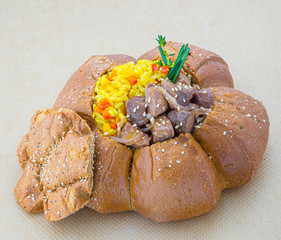 beef with rice in bread bowl