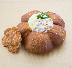 fish with mashed tomatoes in bread bowl