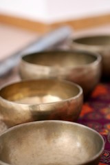 Tibetan singing bowls close up for a sound healing therapy session.