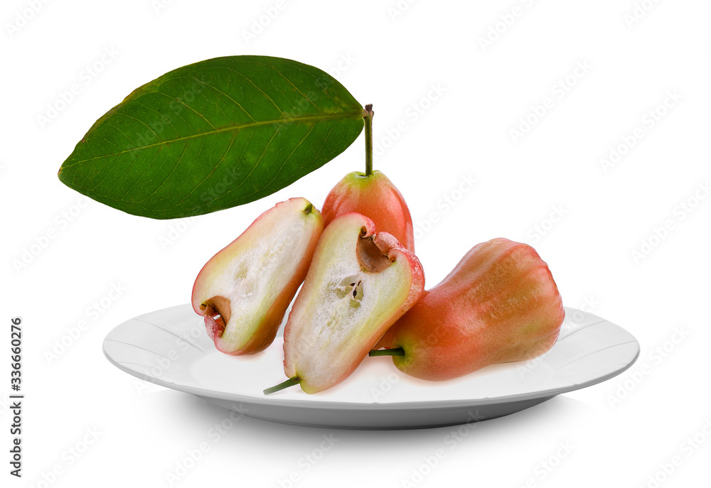 Wall mural Rose apple in white plate on white background