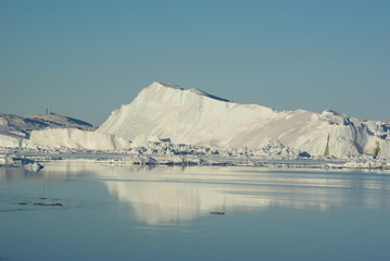 Iceberg reflecting in ocean, Ilulissat Greenland