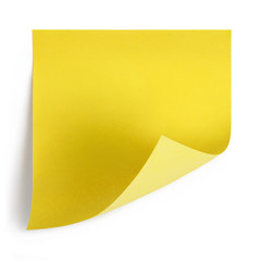 Blank yellow sticker with curled corner, isolated on white background