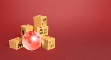 Fototapeta premium Red glass globe and cardboard boxes. Delivery of goods, shipping. Global economy, import export freight traffic. Globalization markets. Economics development. International world trade distribution