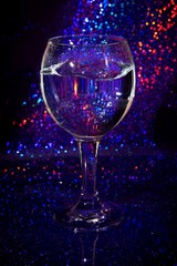 glass of water on a background of light music vertical photograph