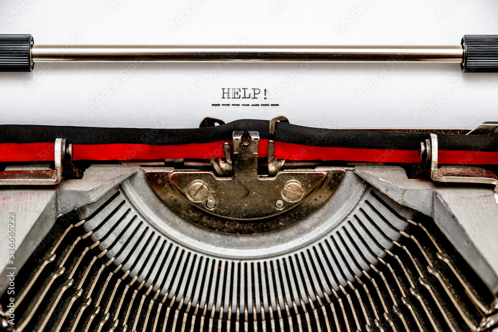 Fototapete call for help typed on an old typewriter. macro shot.