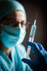 Nurse holding a syringe with the coronavirus COVID-19 vaccine