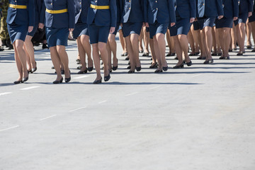 Women in military uniform march on the parade. Russia.