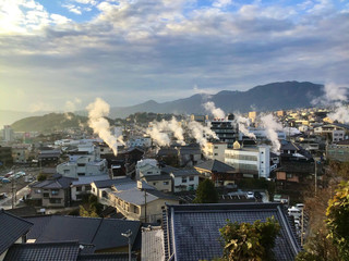 Beppu hot springs with rising steam in Oita