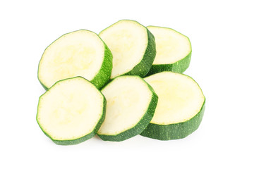 fresh green zucchini slices isolated on white background