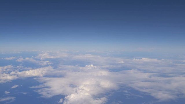 Aerial shot above the clouds in 4K