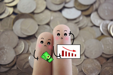 Two fingers are decorated as two person. They are worrying about the economy outlook.