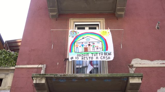 Europe, Italy, Milan March 2020, Coronavirus emergency - On the windows of the city hang sheets designed by children with rainbow and the words "everything will be fine" ( Tutto Andra' bene )