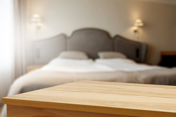 Table background of free space and blurred bed  - 336674050