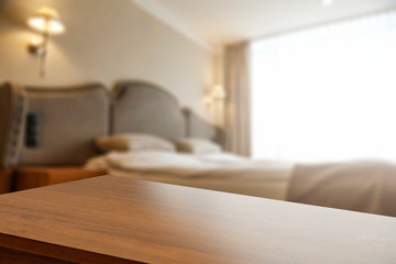 Table background of free space and blurred bed 