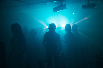 silhouettes of people at a party