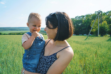 happy mother and son in field