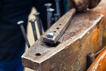 blacksmith working with a hammer	