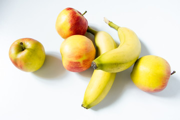 Composition with fruits: Banana and apple isolated on white background