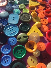 rainbow made of sewing buttons background - stock photo