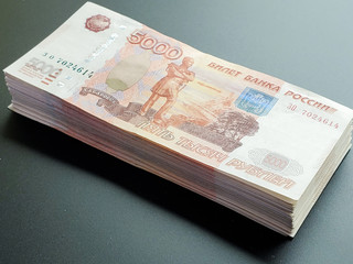 wad of Russian money on an isolated dark background. a large amount of money.