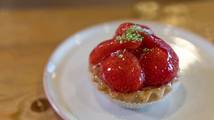 strawberry cupcake on a platter close-up